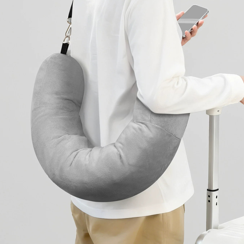 Gray U-shaped travel pillow hands-free carry